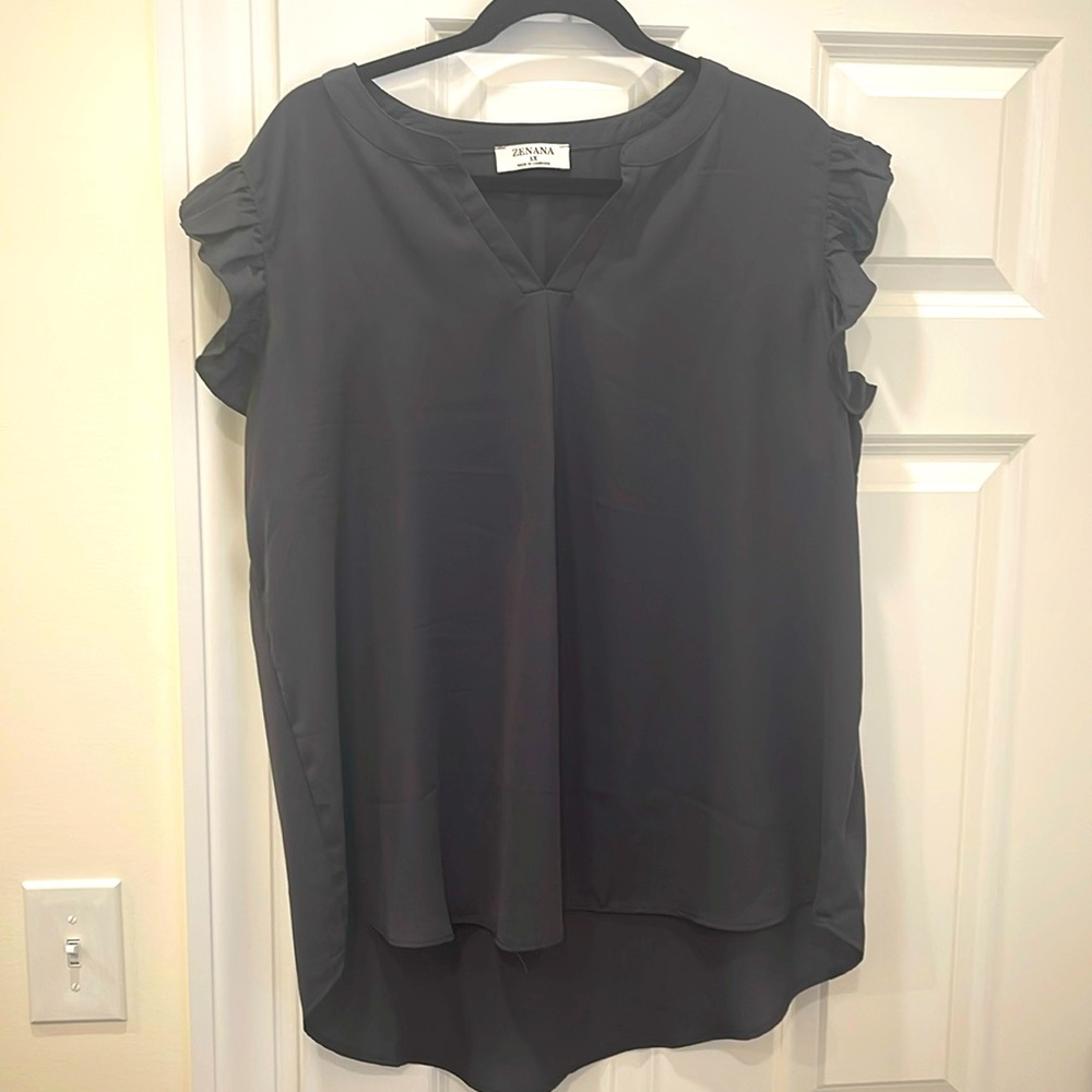 Flowy women’s top with ruffle cap sleeve detail